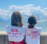 Children wearing signed personalised Bournes Green Junior School leavers shirt with their name, school and on the years spent at the school on the back.